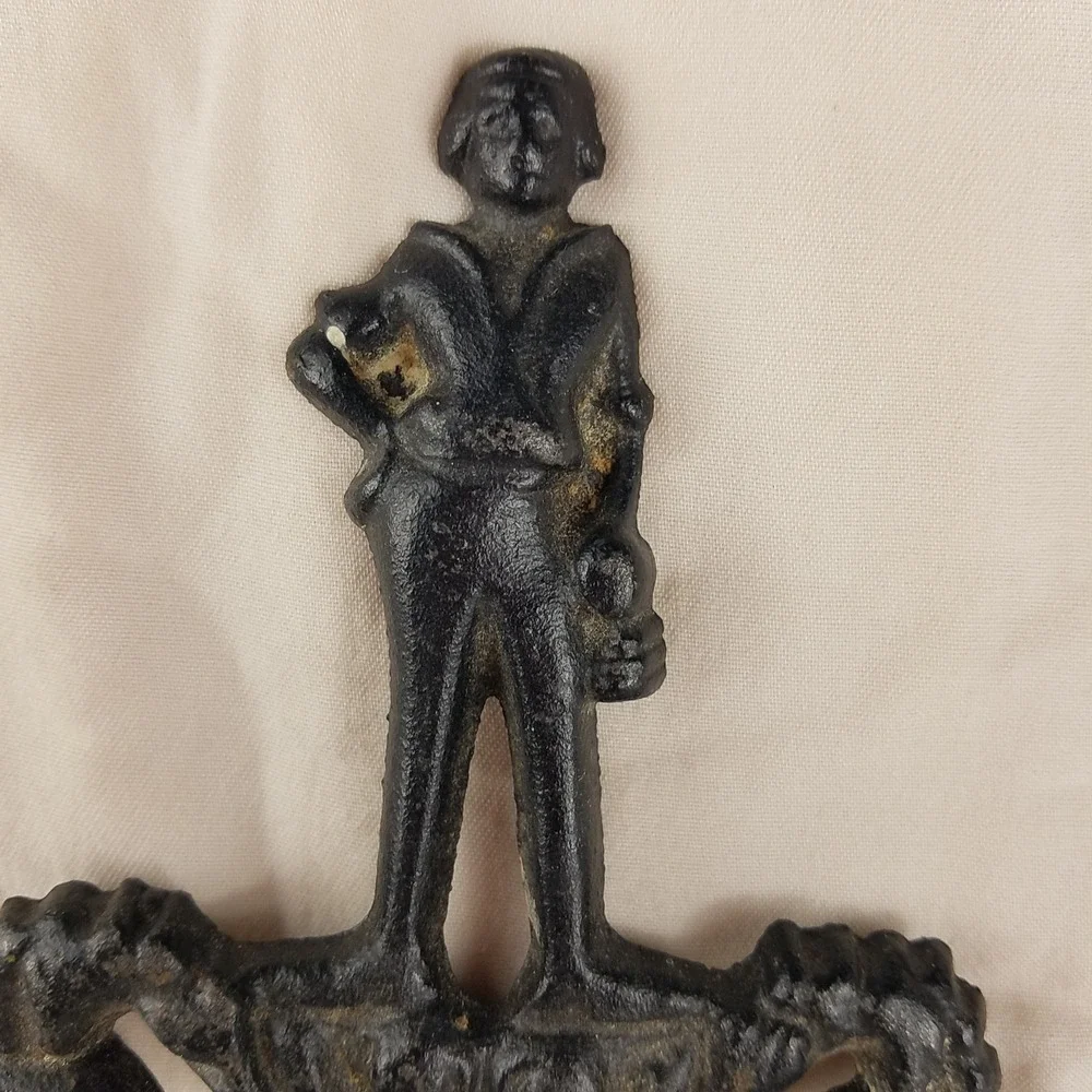 Vintage 1955 Cast Iron Trivet T-11 Cupid Sailor Cherub Black Metal Hot Plate 8.5